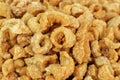 Close up of pork snack or pork scratching at market, crispy fried pork skin and blistered is traditional food in Thailand