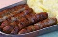 Close grilled Nuremberg sausages with potato Royalty Free Stock Photo