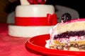 Close Up of a Portion of a Pink Covered Cake with Blackberrier a