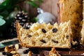 Close-up of a portion of sweet bread or Italian panettone with dried fruits inside. Typical Christmas bread