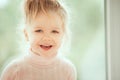 Close up portrait of adorable beautiful baby girl smiling and looking to cam. Childhood Kids People concepts. Caucasian Fashion Be Royalty Free Stock Photo