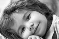 Close-up portrait of adorable happy little boy smiling at camera. Royalty Free Stock Photo