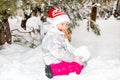 Close up portrait of adorable happy little girl grinning happily at the camera on a sunny winter`s day Royalty Free Stock Photo