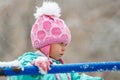 Close-up portrait of adorable little girl wearing knitted pink hat outdoors Royalty Free Stock Photo