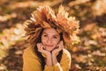 Close up portrait of adorable pretty girl wear maple leaves wreath head touch hands face chin enjoy forest autumn rest