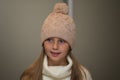 Close-up portrait of adorable smiling child girl wearing knitted hat Royalty Free Stock Photo