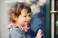 Outdoor portrait of adorable toddler girl with curly hair Royalty Free Stock Photo