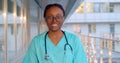 Close up portrait of African-American female healthcare worker standing outside hospital Royalty Free Stock Photo