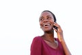 Close up african american young woman talking on cell phone isolated over white background Royalty Free Stock Photo