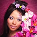 Close-up portrait of asian girl with flowers Royalty Free Stock Photo