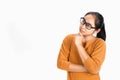 Close up portrait of Asian woman thoughtful girl, wearing glasses and holding hand near the face, looking seriously up, standing Royalty Free Stock Photo