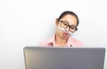 Close up portrait of Asian woman thoughtful girl, wearing glasses, looking tablet and making funny face, sitting over white Royalty Free Stock Photo