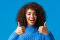 Close-up portrait of assertive pleased and satisfied african-american curly-haired woman saying okay, accept something