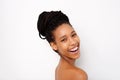 Close up attractive african woman laughing with naked shoulders on white background Royalty Free Stock Photo