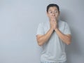 Asian Man Shocked and Closing his Mouth