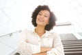 Close up attractive middle age african american woman smiling with arms crossed Royalty Free Stock Photo