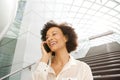 Close up attractive middle age african american woman smiling and talking with cellphone Royalty Free Stock Photo