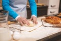 Close-up portrait of attractive smiling happy senior aged woman is cooking on kitchen. Grandmother making tasty baking Royalty Free Stock Photo