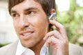 Businessman with ear set. Royalty Free Stock Photo