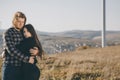 Young couple in love outdoor. Stunning sensual outdoor portrait of young stylish fashion couple posing in field. Royalty Free Stock Photo