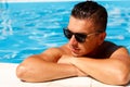 Close up portrait of attractive young man in sunglasses resting Royalty Free Stock Photo