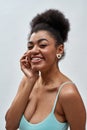 Close up portrait of attractive young woman with afro hair wearing blue underwear smiling at camera, posing isolated Royalty Free Stock Photo