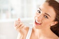 Close-up portrait of an attractive young woman eating yogurt Royalty Free Stock Photo