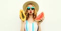 Close up portrait of attractive young woman with fruits slice of watermelon and papaya blowing red lips sending sweet air kiss Royalty Free Stock Photo