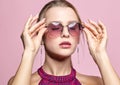 Close-up portrait of attractive young woman in tinted glasses  and closed eyes Royalty Free Stock Photo