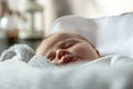A close-up portrait of a baby girl who sleeps in a cradle or crib. Three-month-old girl sleeps sweetly Royalty Free Stock Photo