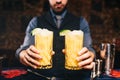 Close up portrait of bartender or barman serving drinks