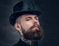 Close up portrait of bearded male with tattooed neck.