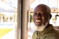 Close-up portrait of bearded smiling african american senior man in retirement home