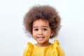 Close-up Portrait of beautiful african american child with fluffy curly hair looking at camera Royalty Free Stock Photo