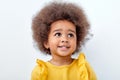 Close-up Portrait of beautiful african american child with fluffy curly hair looking up Royalty Free Stock Photo