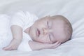 close up portrait of a beautiful baby on white background at home