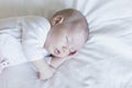 close up portrait of a beautiful baby on white background at home