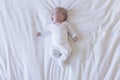 close up portrait of a beautiful baby yawning on white background at home