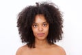 Close up portrait beautiful black woman with bare shoulders staring