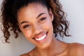 Close up beautiful black woman smiling against white wall Royalty Free Stock Photo