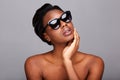 Close up beautiful black woman with sunglasses and bare shoulders Royalty Free Stock Photo