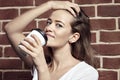 Close-up portrait of beautiful blonde woman drinking coffee in p Royalty Free Stock Photo