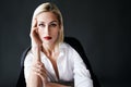 Close up portrait of beautiful blonde woman with red lips in elegant white shirt and black jacket posing isolated on Royalty Free Stock Photo