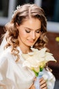 close-up. portrait of a beautiful bride with a bouquet of calla flowers