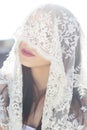 Close-up portrait of a beautiful bride hidden veil Royalty Free Stock Photo