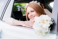 Close-up portrait of a beautiful bride in a wedding car window. The concept of wedding happiness. Royalty Free Stock Photo