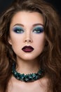 Close-up portrait of beautiful brunette woman with modern fashion make up Royalty Free Stock Photo