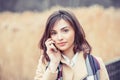 Close up portrait of a beautiful business woman talking listening to phone call on mobile outdoors park background Royalty Free Stock Photo