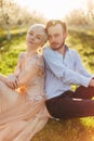 Close up portrait of beautiful couple leaning on each other backs and enjoying lovely time together. Couple in love Royalty Free Stock Photo