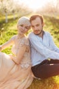 Close up portrait of beautiful couple leaning on each other backs and enjoying lovely time together. Couple in love Royalty Free Stock Photo